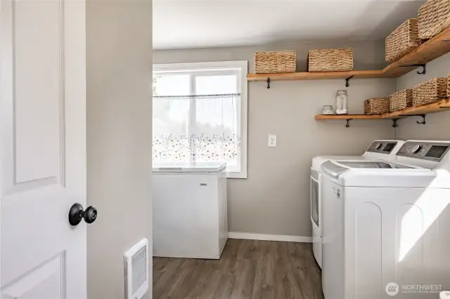 Dedicated laundry room with room for additional storage.