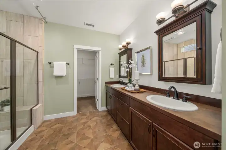 Primary bath with custom mirrors and oil rubber bronze fixtures.
