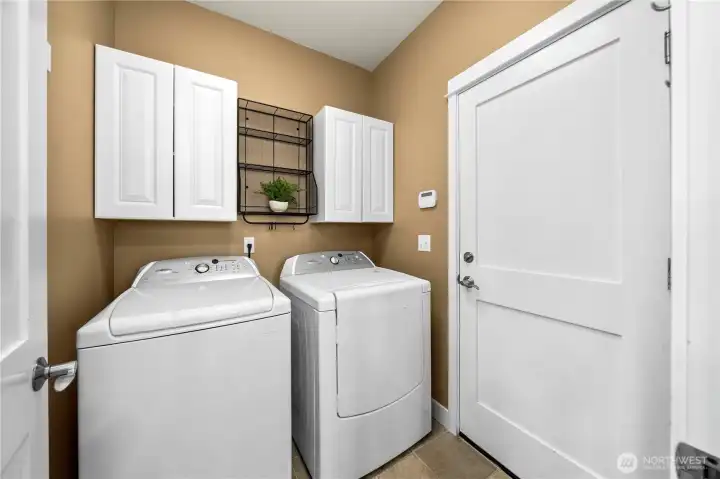 Laundry room with extra storage.