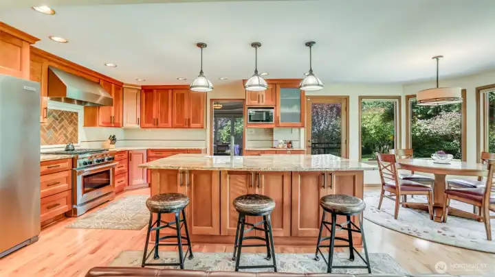 Thoughtfully remodeled with style and function—granite countertops, custom cabinetry, and a center island for gathering. All kitchen appliances stay!