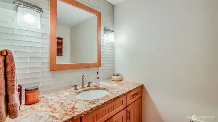 Beautifully finished half bath offering both style and functionality.