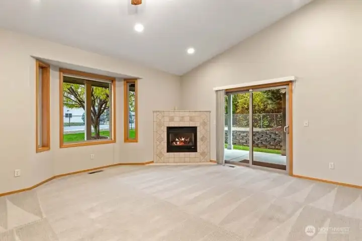 Curl up on a chilly winter eve in front of this toasty warm gas fireplace. Slider goes out to covered wrap around porch area for year around outdoor living.