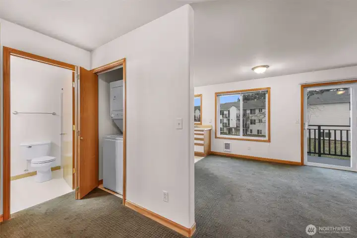 Small flex space outside bedrooms and bathrooms with room for a desk, book shelves or small sitting area. Stackable washer and dryer with storage adjacent
