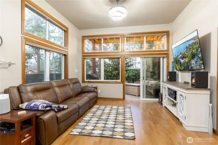 Living room with perspective of high 11-foot ceilings.  Upper blinds have electronic controls.