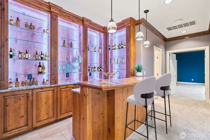 Wet bar complete with sink and beverage cooler.