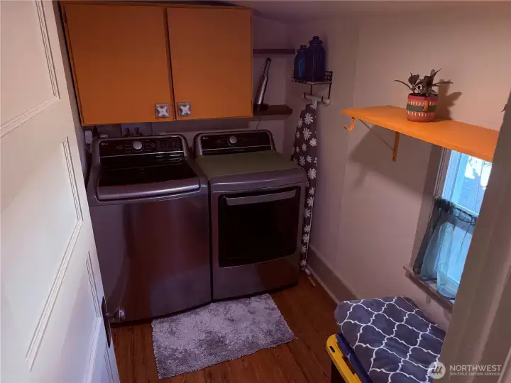 Stainless Steel Washer/Dryer stay with home. Located in separate room off of dining area.