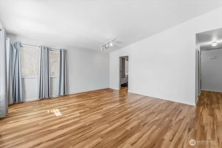 The units have been well updated and maintained over time. Step into the living room featuring vaulted ceilings and abundant natural light.