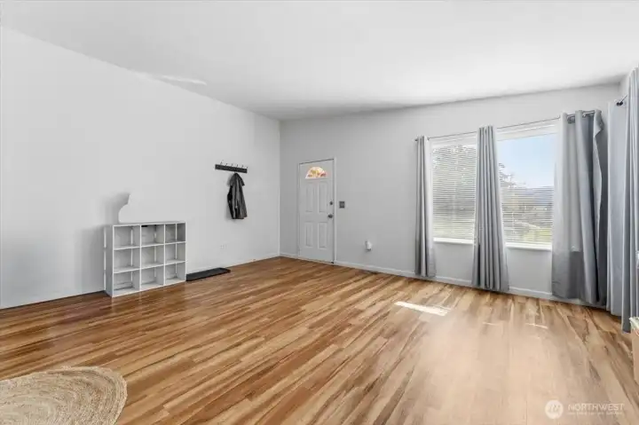 The units have been well updated and maintained over time. Step into the living room featuring vaulted ceilings and abundant natural light.