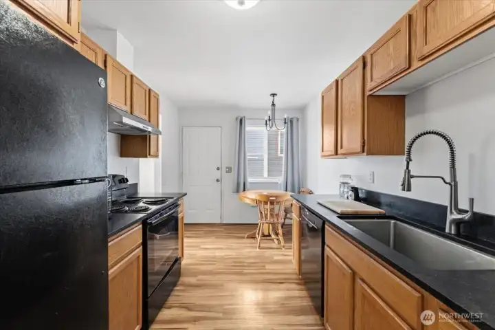 Full kitchen with updated countertops and a cozy dining nook just off the kitchen.