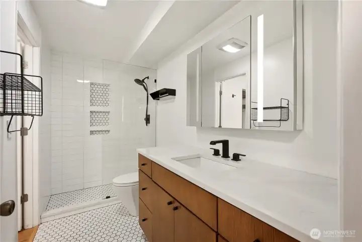 Fully updated bathroom with contemporary details & large medicine cabinet.