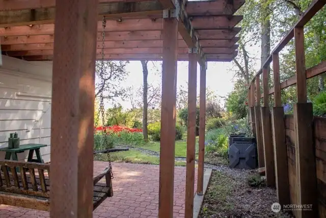 Underneath deck and side of retaining wall