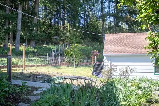 garage with view of stari case into hillside