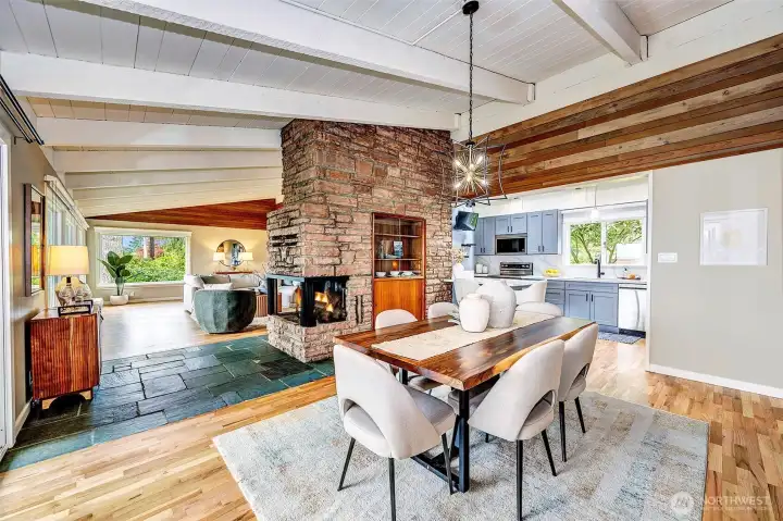 The beautiful stone fireplace anchors the living and dining rooms.