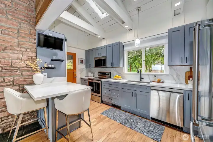 Remodeled kitchen with skylights flooding it with natural light, equipped with all the comforts you desire.