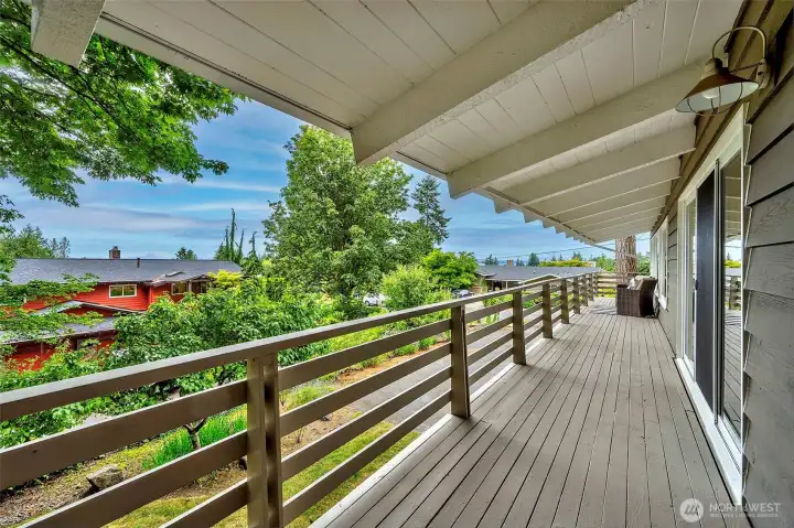 Full length deck for relaxing, enjoying peaceful moments, partial views and beautiful sunsets.