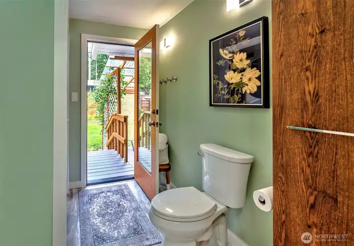 Door leading out to hot tub and beautifully manicured gardens.