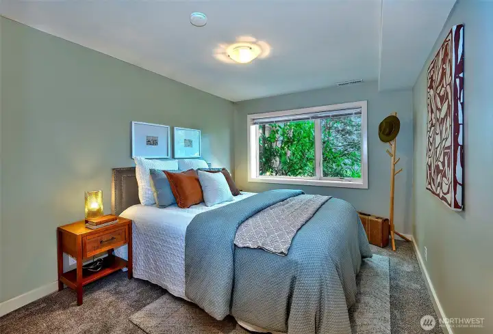 Second Bedroom with walk-in closet and organizer system.