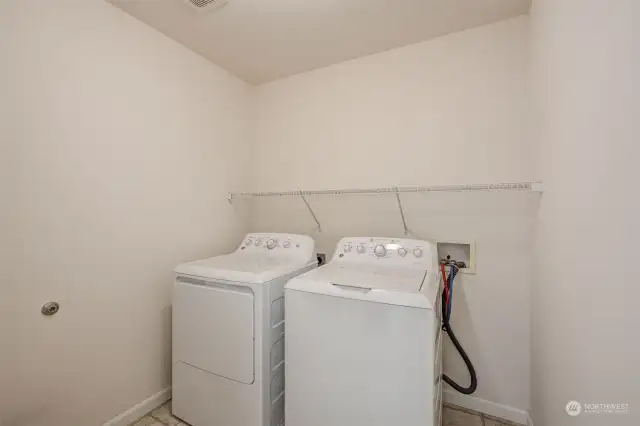 Laundry room, just off primary bedroom and garage.