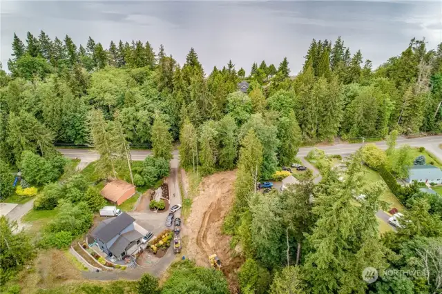 Drone shot from above the back side of the property, looking towards Hood Canal.