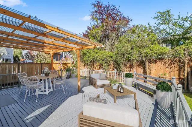 entertainment size covered deck in the back yard. Relaxing here in your own private & tranquil backyard! This photo is virtually staged.