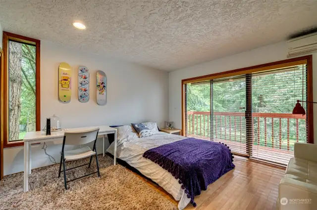 Main level bedroom with private deck