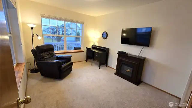 The den off the main floor living room is a perfect tv room, office, library, music room, studio or ....