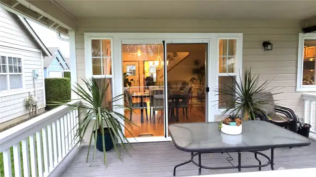 A fully covered back back deck overlooking the private back lawn with hedge trees is adjacent to the large concrete patio for added living space.