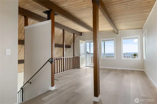 Spacious open loft with personal deck off the water side.