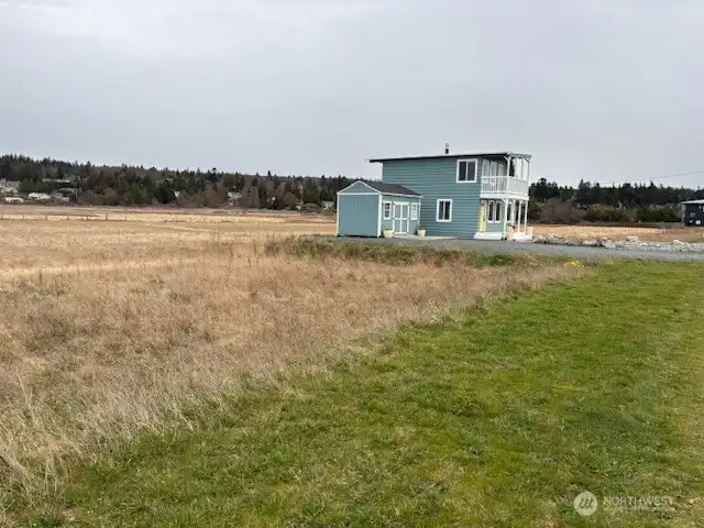 Vacant lot to the West is included with the Cottage