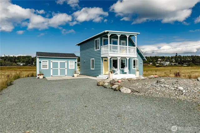 Long and wide driveway allows multiple cars to easily park