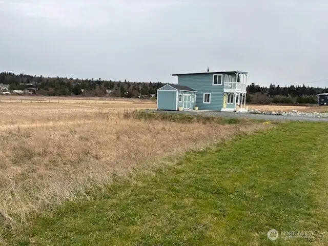 Vacant lot to the West is included with the Cottage