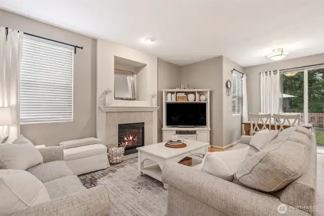 Inviting Family Room featuring gas fireplace with tile surround