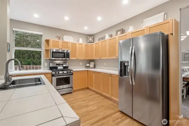Tile countertops and stainless appliances