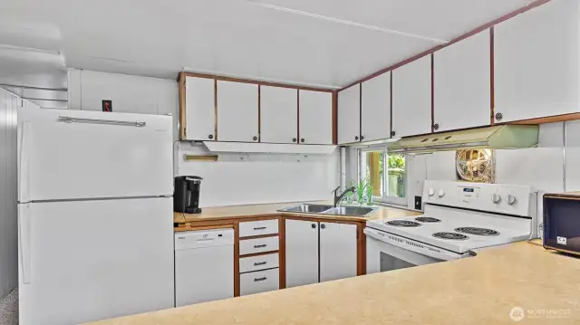 The kitchen has a ton of storage and is light and bright.