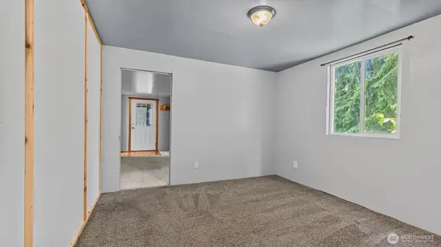This view from the dining room looks towards the bonus room and front door.