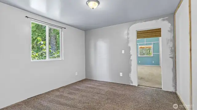 The flex space that has been used as a dining room.