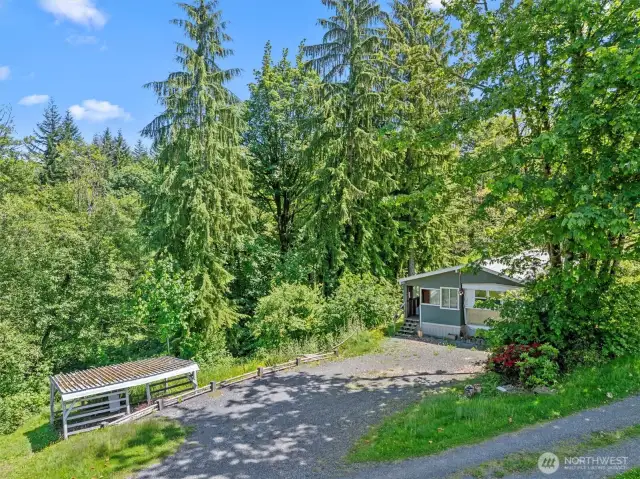 Home is well situated with a territorial view, plenty of parking and a wood shed for those winter nights when you want to use the wood-burning stove.
