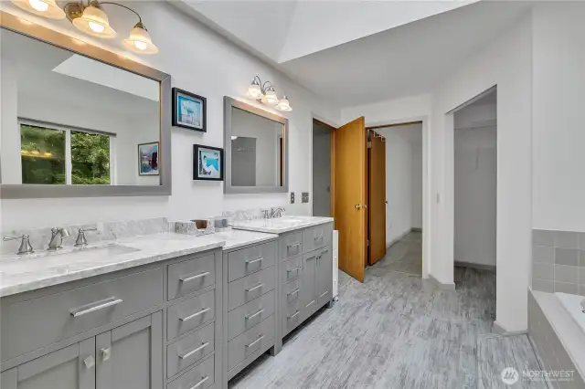 This large updated primary bathroom is ready for you.