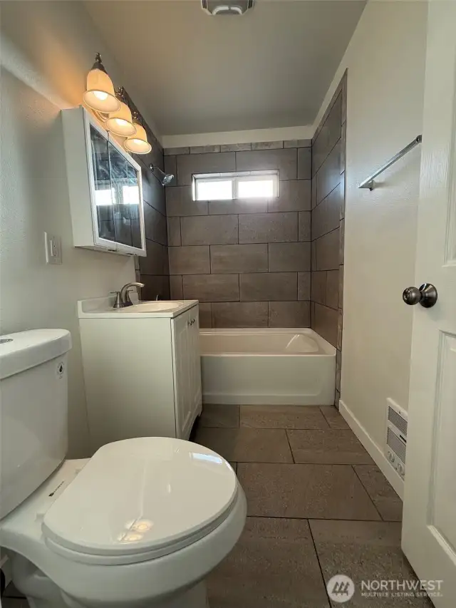 The window above the shower provides just the right amount of natural light for this space