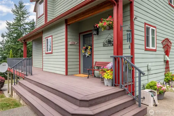 Wide access on the cheery front porch (which can lead you all the way around the full-length back deck)