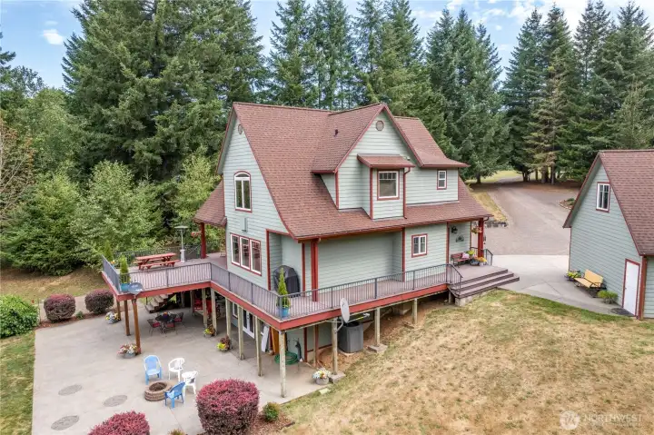 Side view of the good stuff - and at the far right, the man door that takes you into the good sized 3 car Garage with bonuses up top!