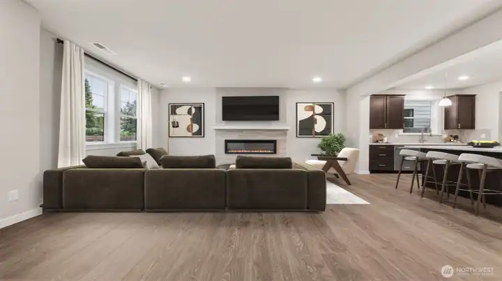 Spacious family room view from the 2nd entry area.  Actual home is under construction and materials, colors, and finishes will vary.  See site agent for details