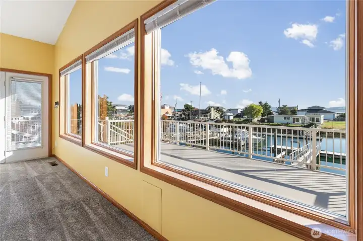 Upstairs living gives you beautiful harbor views through the windows, and out on the deck.