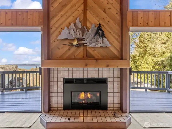 Gas Fireplace in Living Room with sliding glass doors out to Deck