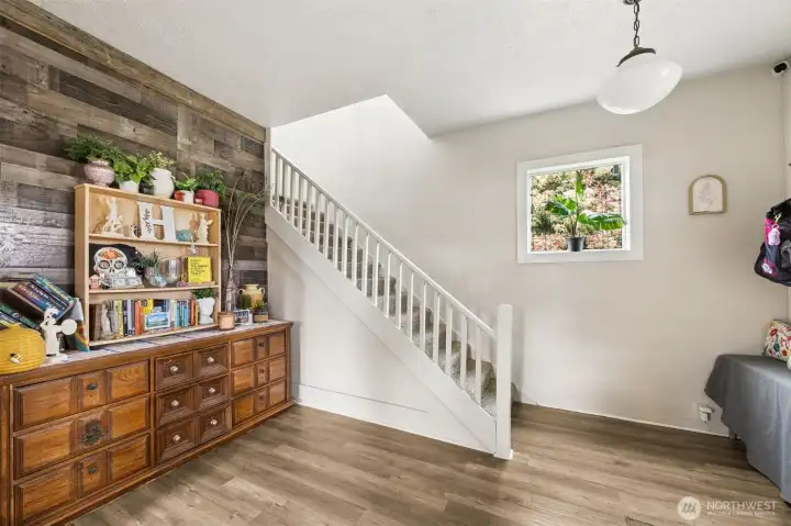 Beautiful entry with accent wall and stairs to 3 upper bedrooms.