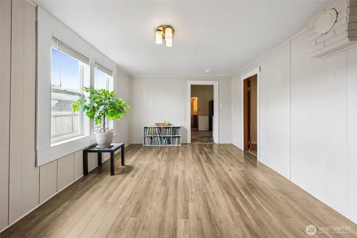 Plank flooring gives warmth as well as eastern facing windows for natural light all day long