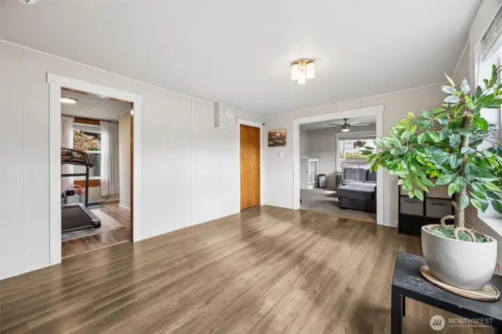 Formal dining looks back to living room and main floor bedroom