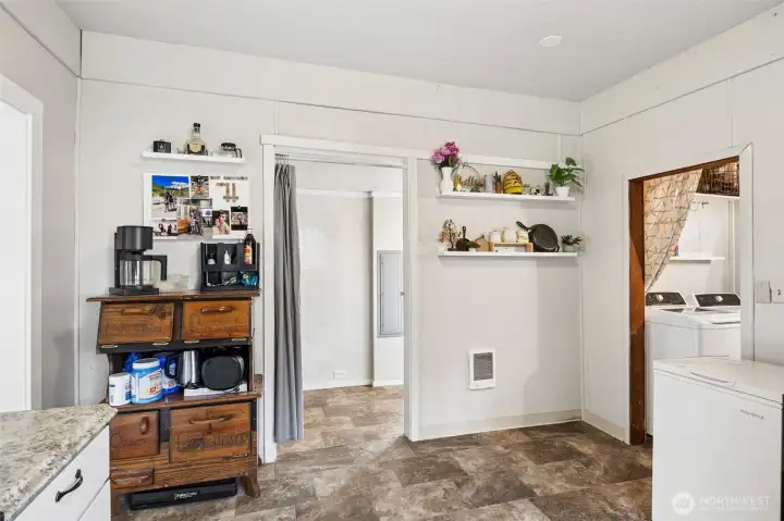 Just off kitchen is access to utility/mud room