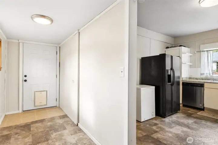Utility/ mudroom with room to get creative- exterior back door leads to detached shop/out building