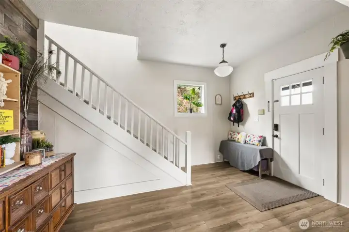 Stairway leading up to 3 additional bedroom and 1 full bath